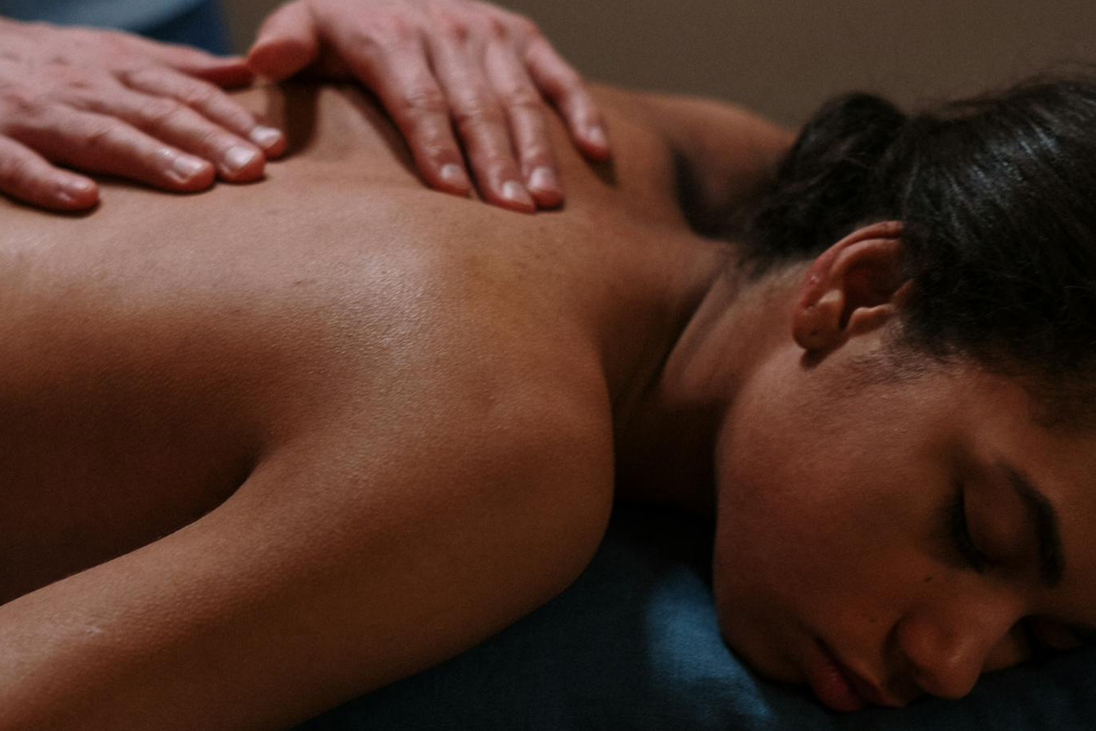 woman-lying-on-blue-bed